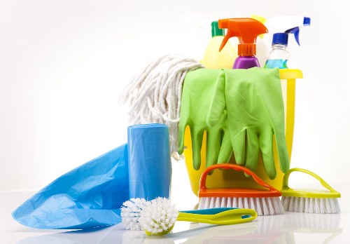 Professional upholstery cleaning of a fabric sofa in a modern living room